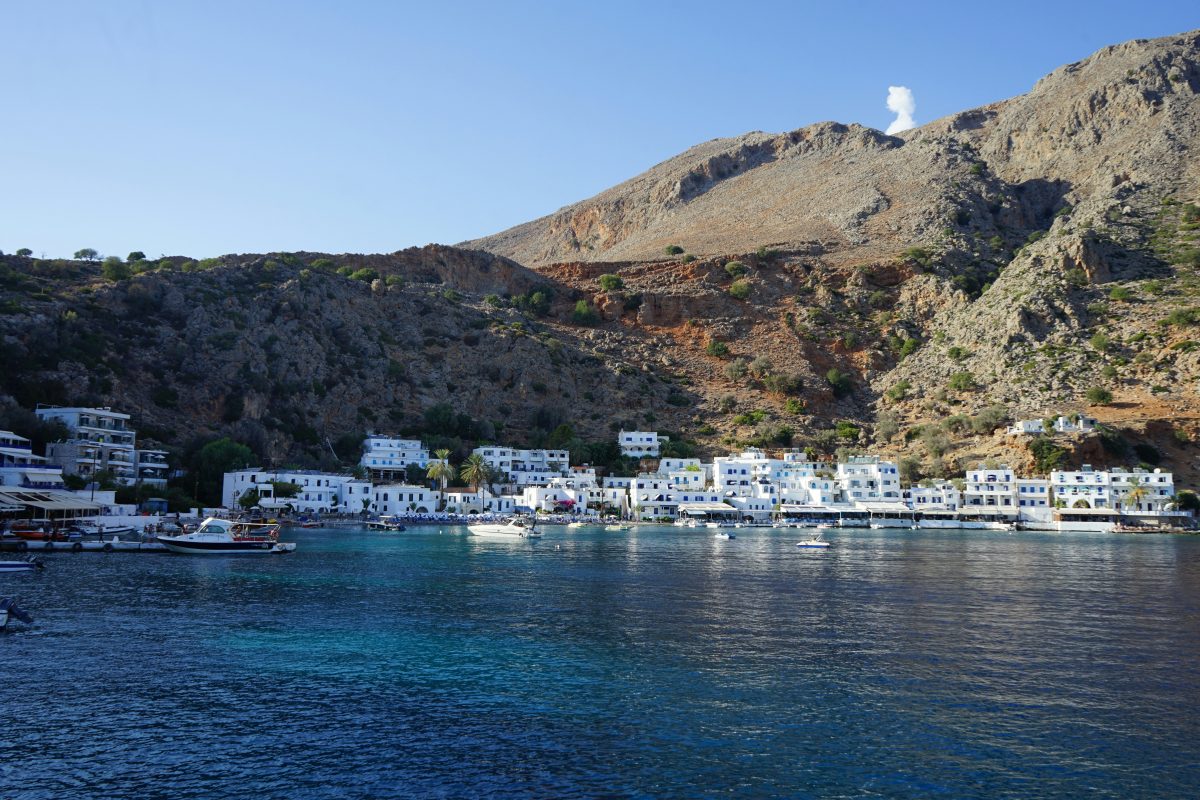 a picture of loutro in crete taken from a boat 